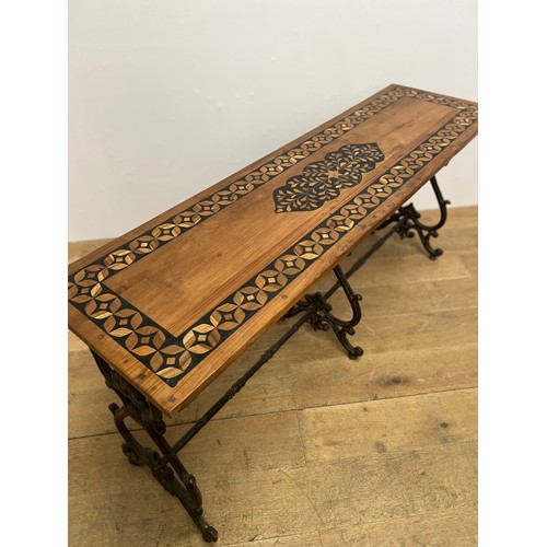 746 - 20th C. Cast iron scroll base teak wood table with three scrolled legs and single stretcher {H 75cm ... 