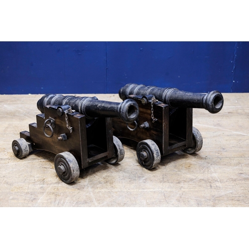 403 - Pair of 19th C. Cast iron deck cannons. {H 61cm x W 39cm x D 73cm }.