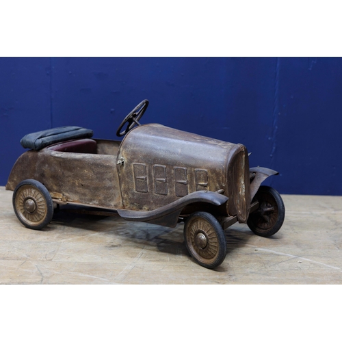 679 - 1940's tinplate children's pedal car { H 50cm x W40cm x L 95cm}.