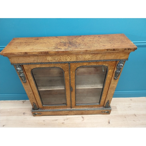 197 - Good quality 19th C. French burr walnut and inlaid side cabinet with ormolu mounts and two glazed do... 