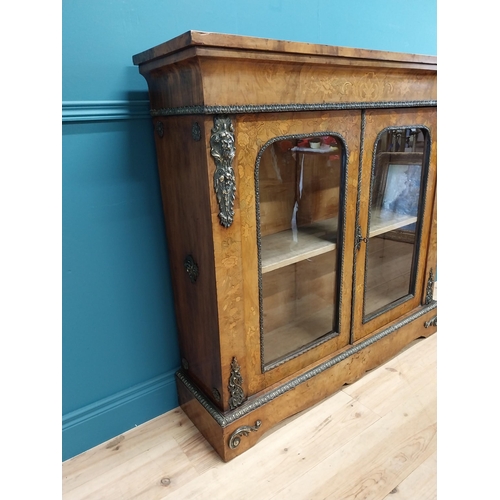 197 - Good quality 19th C. French burr walnut and inlaid side cabinet with ormolu mounts and two glazed do... 