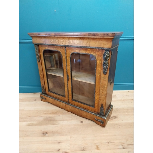 197 - Good quality 19th C. French burr walnut and inlaid side cabinet with ormolu mounts and two glazed do... 