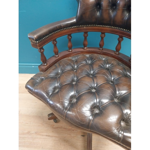 1143 - Good quality deep buttoned leather and mahogany Captain's swivel office chair. {86 cm H x 64 cm W  x... 