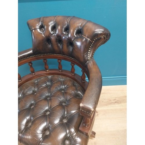 1143 - Good quality deep buttoned leather and mahogany Captain's swivel office chair. {86 cm H x 64 cm W  x... 