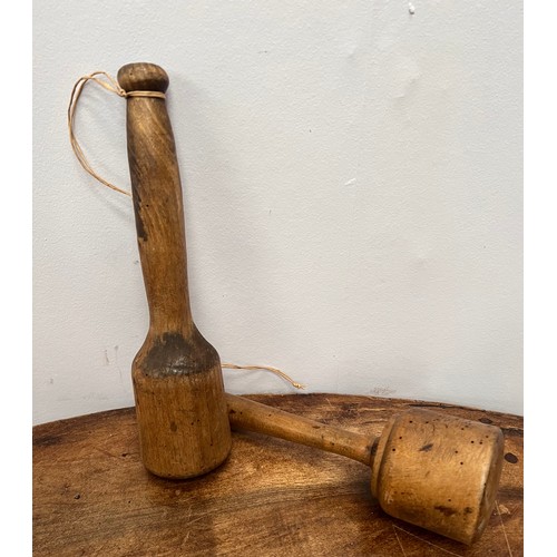 660 - Pair of wooden potato masher {H 26cm x D 6cm}.