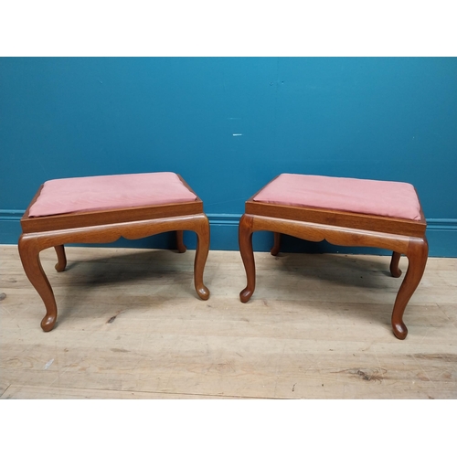 107 - Pair of mahogany stools with upholstered seats on cabriole legs. {35 cm H x 44 cm W x 36 cm D}.