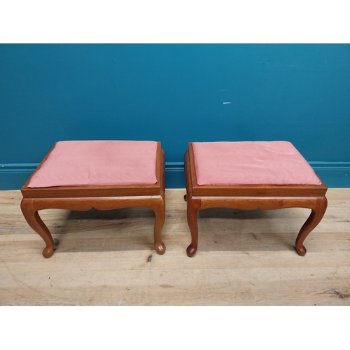 107 - Pair of mahogany stools with upholstered seats on cabriole legs. {35 cm H x 44 cm W x 36 cm D}.