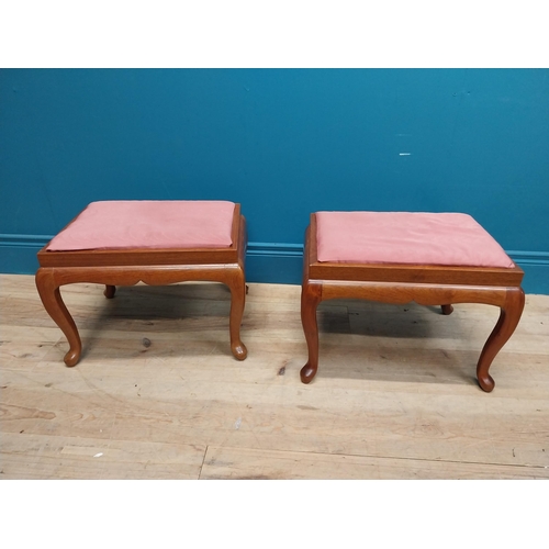 107 - Pair of mahogany stools with upholstered seats on cabriole legs. {35 cm H x 44 cm W x 36 cm D}.