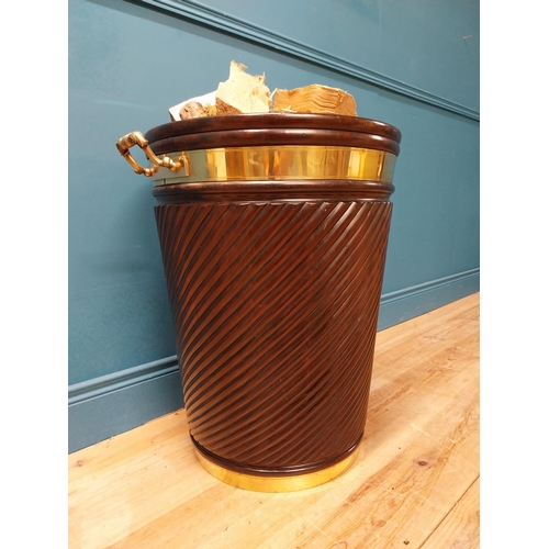 109 - Irish mahogany spiral brass bound peat bucket in the Georgian style {66cm H x 62cm Dia}