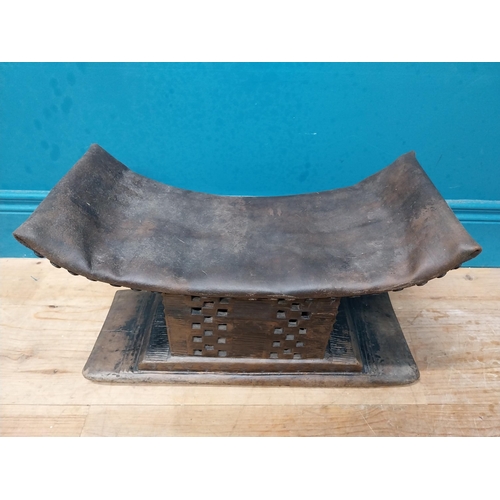 119 - African hardwood stool with upholstered seat. {23 cm H x 46 cm W x 15 cm D}.