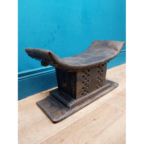 119 - African hardwood stool with upholstered seat. {23 cm H x 46 cm W x 15 cm D}.