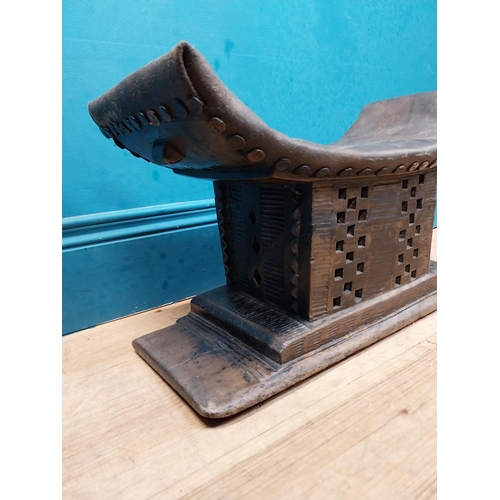 119 - African hardwood stool with upholstered seat. {23 cm H x 46 cm W x 15 cm D}.