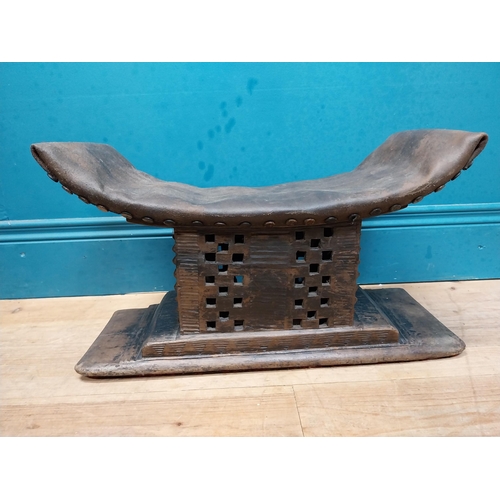 119 - African hardwood stool with upholstered seat. {23 cm H x 46 cm W x 15 cm D}.