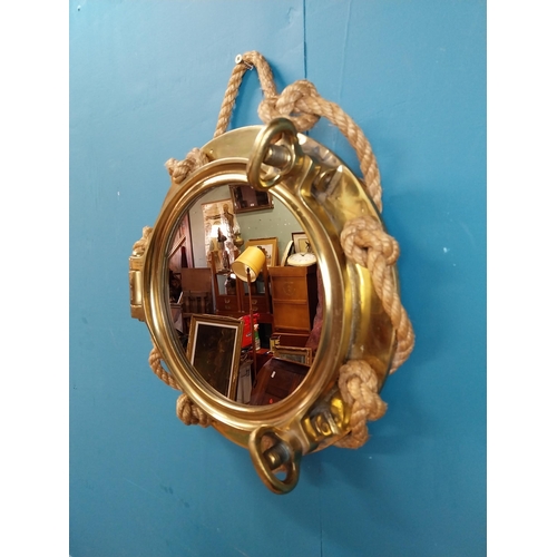 123 - Brass ship's porthole in the form of mirror with rope decoration stamped J J Woods Rainhill. {40 cm ... 