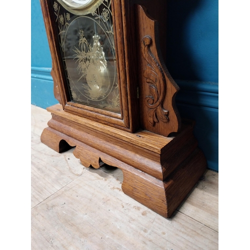 135 - Early 20th C. oak gingerbread clock. {60 cm H x 37 cm W x 14 cm D}.