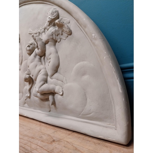 151 - Plaster wall plaque in the Classical style depicting cherubs. {52 cm H x 117 cm W}.