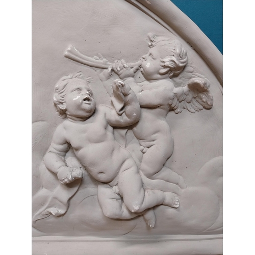 151 - Plaster wall plaque in the Classical style depicting cherubs. {52 cm H x 117 cm W}.