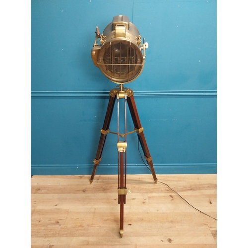 156 - Good quality brass and mahogany theatre lamp on tripod base. {163 cm H x 60 cm Dia.}