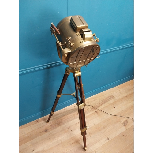 156 - Good quality brass and mahogany theatre lamp on tripod base. {163 cm H x 60 cm Dia.}