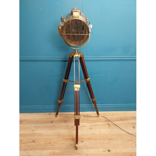 156 - Good quality brass and mahogany theatre lamp on tripod base. {163 cm H x 60 cm Dia.}