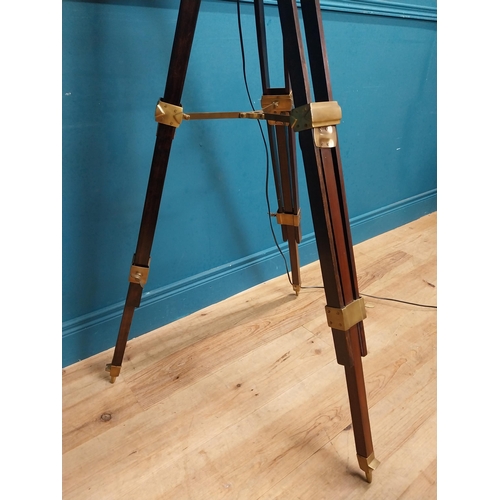 156 - Good quality brass and mahogany theatre lamp on tripod base. {163 cm H x 60 cm Dia.}