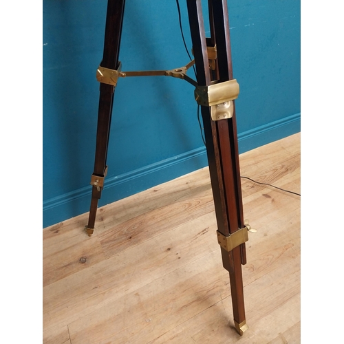 156 - Good quality brass and mahogany theatre lamp on tripod base. {163 cm H x 60 cm Dia.}