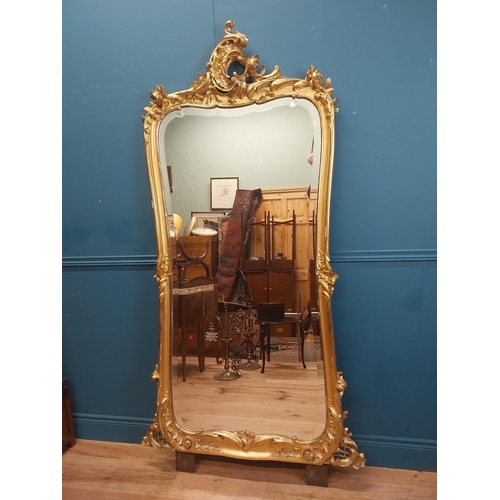 162 - 19th C. French giltwood pier mirror surmounted with flowers. {186 cm H x 102 cm W}.