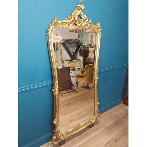 162 - 19th C. French giltwood pier mirror surmounted with flowers. {186 cm H x 102 cm W}.