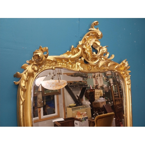 162 - 19th C. French giltwood pier mirror surmounted with flowers. {186 cm H x 102 cm W}.