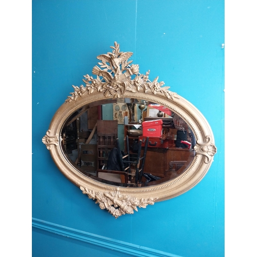 167 - 19th C. oval gilt mirror with floral decoration. {77 cm H x 81 cm W}.