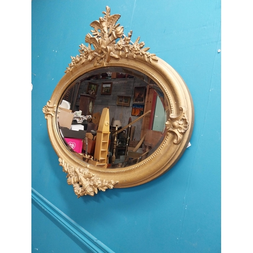 167 - 19th C. oval gilt mirror with floral decoration. {77 cm H x 81 cm W}.