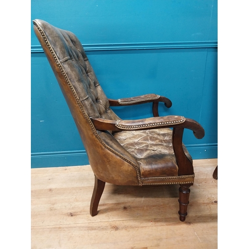 168 - Pair of good quality deep buttoned leather upholstered library chairs on turned tapered legs. {108 c... 