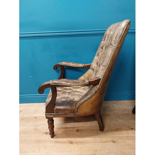 168 - Pair of good quality deep buttoned leather upholstered library chairs on turned tapered legs. {108 c... 