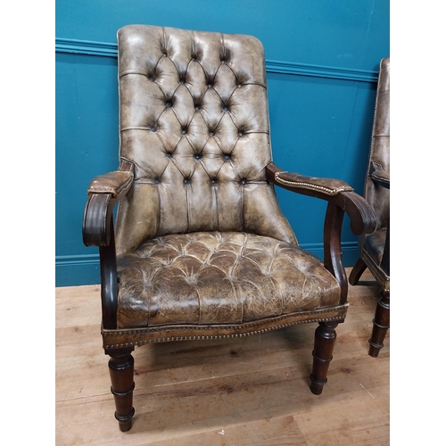 168 - Pair of good quality deep buttoned leather upholstered library chairs on turned tapered legs. {108 c... 