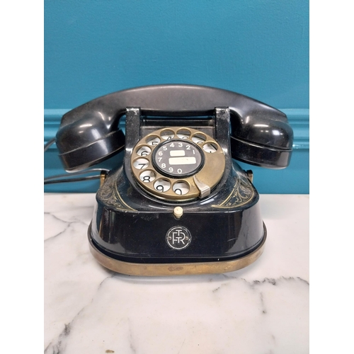 186 - 1950's brass and metal telephone. {14 cm H x 26 cm W x 15 cm D}.