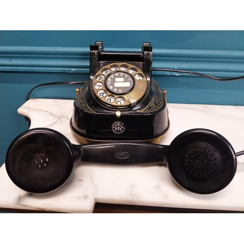 186 - 1950's brass and metal telephone. {14 cm H x 26 cm W x 15 cm D}.