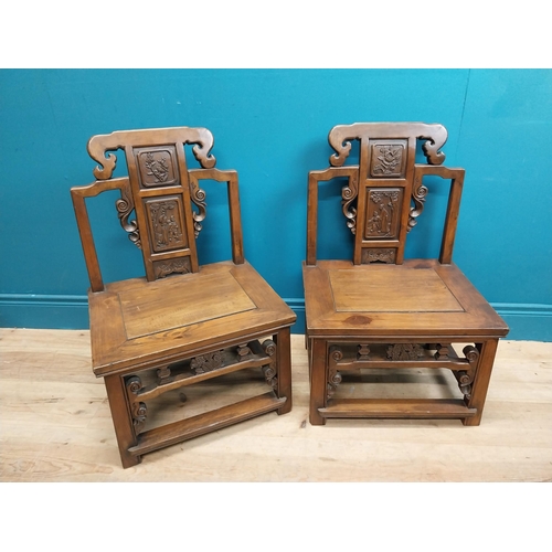 187 - Pair of Chinese hardwood chairs with scroll and leaf decoration. {75 cm H x 49 cm W x 41 cm D}.