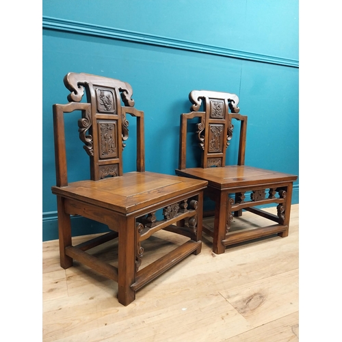 187 - Pair of Chinese hardwood chairs with scroll and leaf decoration. {75 cm H x 49 cm W x 41 cm D}.