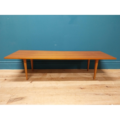 189 - Mid Century teak coffee table on square tapered legs. {34 cm H x 138 cm W x 46 cm D}.