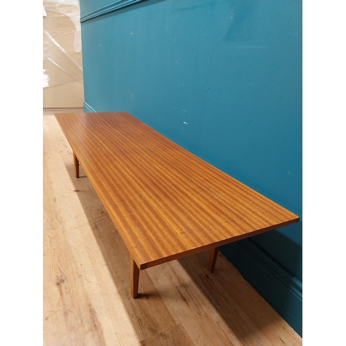 189 - Mid Century teak coffee table on square tapered legs. {34 cm H x 138 cm W x 46 cm D}.