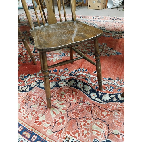 192 - Set of six 1950s pine wheel back Kitchen chairs raised on turned legs and single stretcher {96 cm H ... 