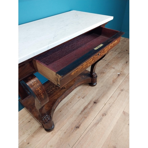 194 - William IV rosewood and satinwood inlaid consul table with marble top and single drawer in the friez... 