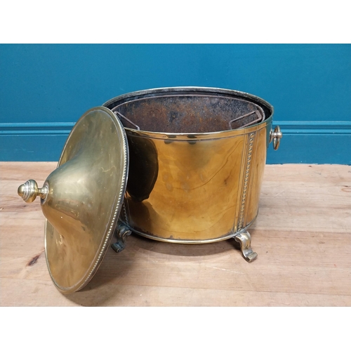 216 - Good quality brass lidded coal bucket with liner and handles on scrolled feet. {44cm H x 40 cm W x 3... 