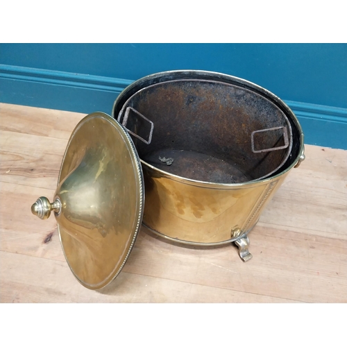 216 - Good quality brass lidded coal bucket with liner and handles on scrolled feet. {44cm H x 40 cm W x 3... 