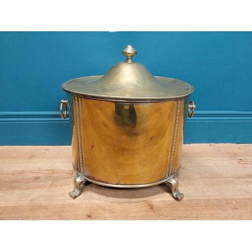 216 - Good quality brass lidded coal bucket with liner and handles on scrolled feet. {44cm H x 40 cm W x 3... 