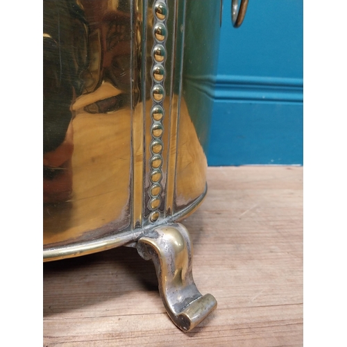 216 - Good quality brass lidded coal bucket with liner and handles on scrolled feet. {44cm H x 40 cm W x 3... 