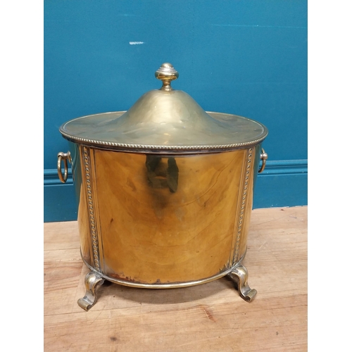 216 - Good quality brass lidded coal bucket with liner and handles on scrolled feet. {44cm H x 40 cm W x 3... 