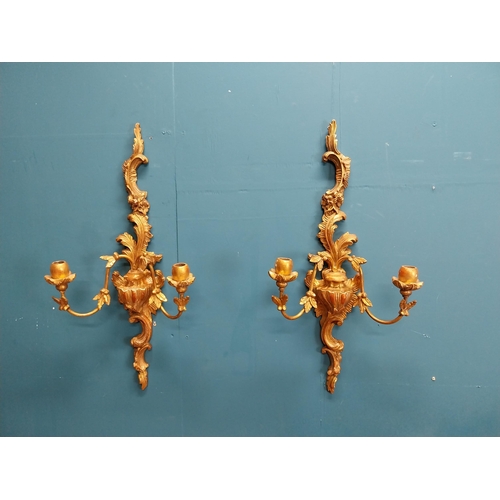 226 - Pair of giltwood wall lights in the Rococo manner. {64 cm H x 32 cm W x 17 cm W}.