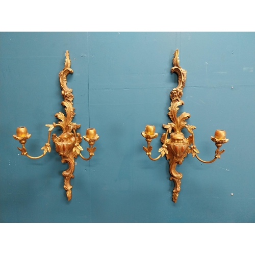 226 - Pair of giltwood wall lights in the Rococo manner. {64 cm H x 32 cm W x 17 cm W}.