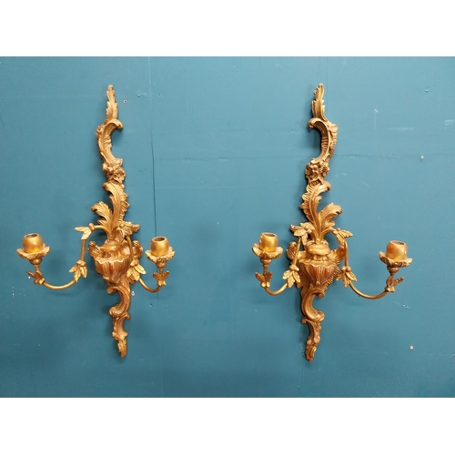 226 - Pair of giltwood wall lights in the Rococo manner. {64 cm H x 32 cm W x 17 cm W}.